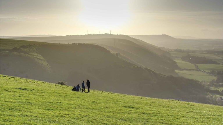 Walkers in the early evening at Devil's Dyke, West Sussex